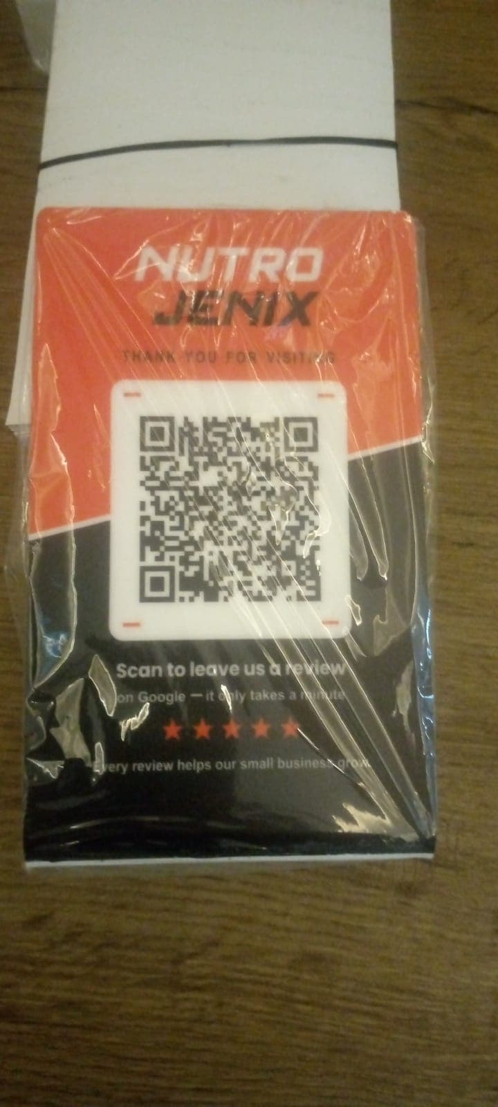 Red and black Google review card for Nutro Jenix