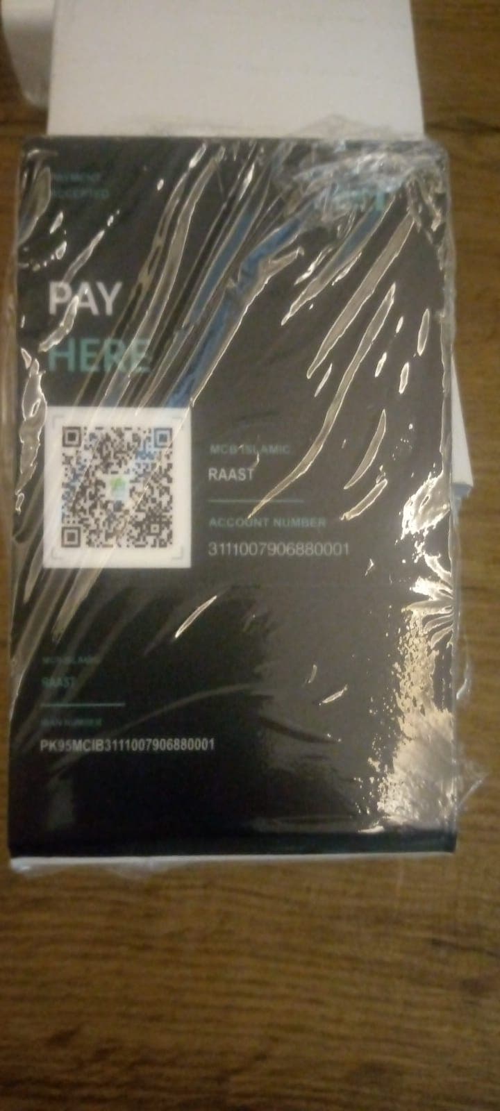 Payment card for Oral Square with a BankIslami Raast QR, account number and IBAN