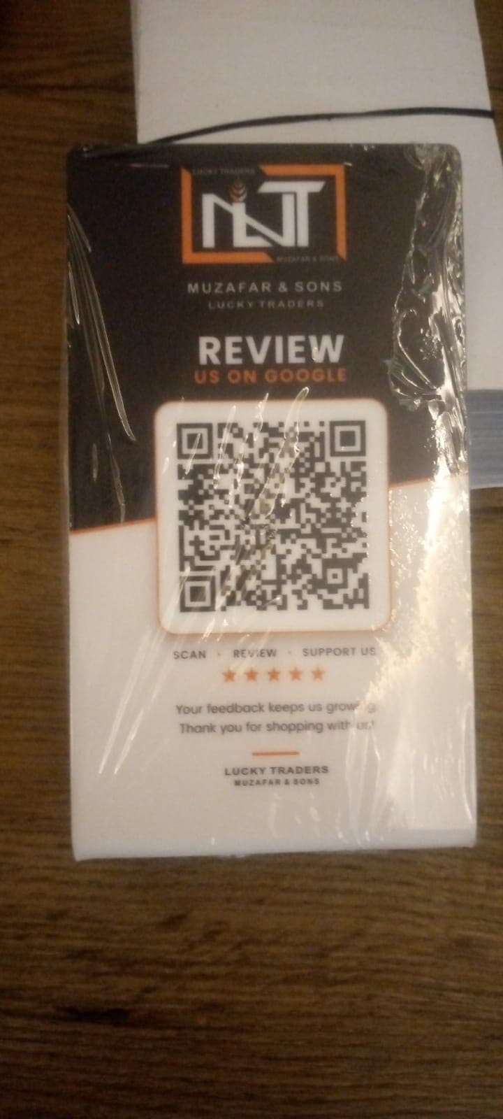 Printed acrylic Google review card for Muzafar & Sons, Lucky Traders